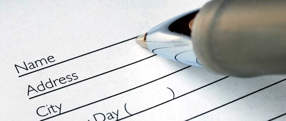 A pen filling out a form
